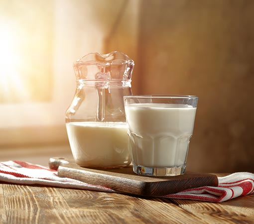 Lactoseintolerantie - Melkkannetje en glas